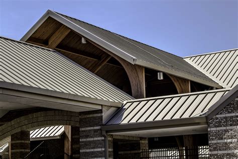 metal roof on house steep roof|working on a steep metal roof.